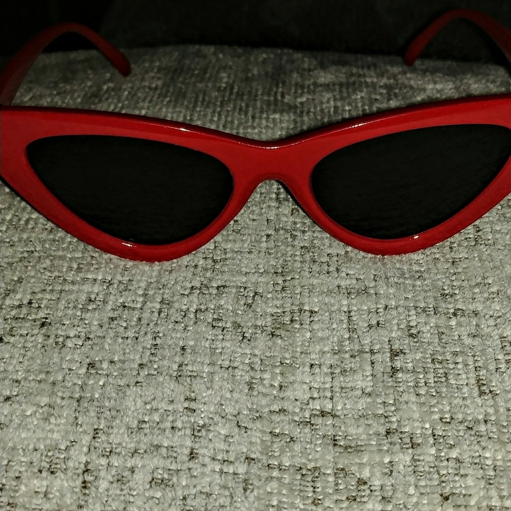 Red cat-eye sunglasses.